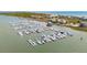 Stunning aerial view of a marina filled with boats near coastal homes and beaches at 68 W 9Th St # B, Folly Beach, SC 29439
