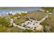 Aerial view of a parking lot surrounded by lush greenery and close to a waterfront at 68 W 9Th St # B, Folly Beach, SC 29439