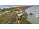 Breathtaking aerial shot showcasing waterfront houses along a marsh, near boats and docks at 68 W 9Th St # B, Folly Beach, SC 29439