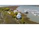 Beautiful coastal property showcasing an elevated house next to a marina and stunning waterfront views at 68 W 9Th St # B, Folly Beach, SC 29439