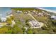 Aerial view of houses and a parking area near beach and coastal marshland at 68 W 9Th St # B, Folly Beach, SC 29439