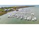 Aerial view of a coastal community marina showcasing boat docks, waterways, and nearby beachfront properties at 68 W 9Th St # B, Folly Beach, SC 29439