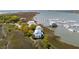 Amazing aerial view showing the property's waterfront location, harbor, docks, boats and unique coastal architecture at 68 W 9Th St # B, Folly Beach, SC 29439