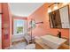 Cozy, vintage-inspired bathroom with tile flooring, unique fixtures and bright natural lighting at 68 W 9Th St # B, Folly Beach, SC 29439