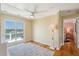 Bright bedroom with balcony access showcasing a lovely view of the water, yachts and boats on the harbor at 68 W 9Th St # B, Folly Beach, SC 29439