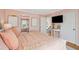 Well lit bedroom boasts a mounted television and easy access to other rooms in the house at 68 W 9Th St # B, Folly Beach, SC 29439
