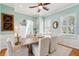 Dining room with neutral walls, white trim, hardwood floors, and an open view to the stairwell at 68 W 9Th St # B, Folly Beach, SC 29439