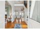 Welcoming entryway with hardwood floors, staircase, and view into the living room at 68 W 9Th St # B, Folly Beach, SC 29439