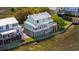 Stunning coastal home with a large elevated deck overlooking marsh views, lush landscaping, and a private dock at 68 W 9Th St # B, Folly Beach, SC 29439