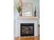 Close-up of a stylish fireplace with decorative mantel and tiled hearth at 68 W 9Th St # B, Folly Beach, SC 29439