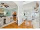 Open-concept living space with hardwood floors connecting to dining and kitchen areas at 68 W 9Th St # B, Folly Beach, SC 29439
