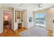 Stylish office featuring custom built-ins, a desk area, and access to a balcony with water views at 68 W 9Th St # B, Folly Beach, SC 29439