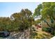 Aerial view showing path with mature trees and neighboring properties at 68 W 9Th St # B, Folly Beach, SC 29439