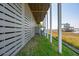 Coastal under-deck area with a hammock, tropical grasses, and a waterfront view at 68 W 9Th St # B, Folly Beach, SC 29439