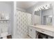 Well-lit bathroom with a vanity, mirror, and shower with a decorative curtain at 700 Daniel Ellis Dr # 3208, Charleston, SC 29412