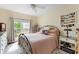 Comfortable bedroom with a ceiling fan, large window, and a cozy bed at 700 Daniel Ellis Dr # 3208, Charleston, SC 29412
