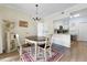 Bright dining area showcasing an oval table, chairs, and open layout to the kitchen at 700 Daniel Ellis Dr # 3208, Charleston, SC 29412