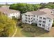 Apartment building featuring multiple levels, balconies, and well-maintained landscaping at 700 Daniel Ellis Dr # 3208, Charleston, SC 29412