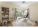 Bright home office featuring a desk, shelving, and large windows with outdoor views at 700 Daniel Ellis Dr # 3208, Charleston, SC 29412
