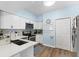 Bright kitchen featuring white cabinets, stainless steel appliances, and a modern tile backsplash at 700 Daniel Ellis Dr # 3208, Charleston, SC 29412