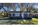 Charming brick single-story home with manicured lawn and mature trees at 8 Eucalyptus Ave, North Charleston, SC 29418