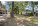 Backyard featuring well-maintained landscaping and an inviting screened-in porch at 8363 Water Ash Way, North Charleston, SC 29420