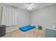 Simple bedroom features neutral carpet, ceiling fan, gray walls and a small mattress at 8363 Water Ash Way, North Charleston, SC 29420