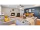 Comfortable living room featuring a cozy fireplace, hardwood floors, and ample seating at 8363 Water Ash Way, North Charleston, SC 29420