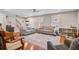 Spacious living room featuring hardwood floors, comfortable seating, and a view of the staircase at 8363 Water Ash Way, North Charleston, SC 29420