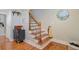 Stairway features hardwood treads, decorative iron railings, and natural light at 8363 Water Ash Way, North Charleston, SC 29420