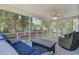Comfortable screened-in porch provides a relaxing outdoor living space at 8363 Water Ash Way, North Charleston, SC 29420