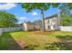 Large backyard with lawn, garden, shed and a white fence at 8956 N Red Maple Cir, Summerville, SC 29485