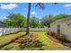 Beautiful backyard with green grass and a white fence at 8956 N Red Maple Cir, Summerville, SC 29485