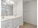 Well-lit bathroom boasts double sinks, white cabinetry, and ample counter space at 8956 N Red Maple Cir, Summerville, SC 29485