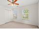 Bedroom featuring carpet floors, natural light, and a large closet at 8956 N Red Maple Cir, Summerville, SC 29485
