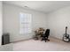 This bedroom has carpeted floors and a bright window at 8956 N Red Maple Cir, Summerville, SC 29485
