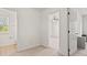 Hallway provides access to bathroom and main bedroom with views of the ceiling fan at 8956 N Red Maple Cir, Summerville, SC 29485