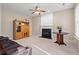 Cozy living room featuring a fireplace, cabinet, and comfortable seating area at 8956 N Red Maple Cir, Summerville, SC 29485