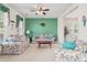 Inviting living room showcasing floral sofas and a wooden table, centered under a ceiling fan at 8956 N Red Maple Cir, Summerville, SC 29485