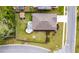 This aerial view highlights the fenced yard, outdoor patio, landscaping, and proximity to the street at 9781 Roseberry St, Ladson, SC 29456