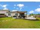 This backyard patio features a pergola, outdoor kitchen, and a seating area perfect for entertaining at 9781 Roseberry St, Ladson, SC 29456
