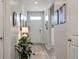 Entrance hall with hardwood floors, elegant decor, and abundant natural light at 9781 Roseberry St, Ladson, SC 29456