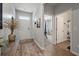 Entry hall features a hardwood floor, adjacent doors, and a glimpse into a brightly lit office at 9781 Roseberry St, Ladson, SC 29456