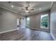 Large bedroom with wood floors, recessed lighting and a barn door that leads to the ensuite bath at 00 Woodland Dr, Summerville, SC 29485
