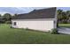 Back view of charming one story home with a well maintained lawn and black roof at 00 Woodland Dr, Summerville, SC 29485