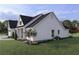 Side view of charming one story home with a well maintained lawn and decorative landscaping at 00 Woodland Dr, Summerville, SC 29485