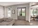 Bright living room with wood floors, french doors to patio, and an open concept to the dining room at 00 Woodland Dr, Summerville, SC 29485