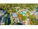 Aerial view showcasing a community pool, tennis court, and lush landscaping at 1025 Riverland Woods Pl # 1108, Charleston, SC 29412