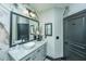 Charming bathroom featuring granite countertop, gray cabinetry, and designer wallpaper at 1025 Riverland Woods Pl # 1108, Charleston, SC 29412