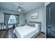 Comfortable bedroom with ceiling fan, natural light, and stylish window coverings at 1025 Riverland Woods Pl # 1108, Charleston, SC 29412